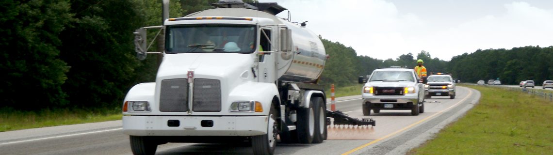 Pavement Technology Inc Application of Reclamite asphalt rejuvenator on four-lane highway