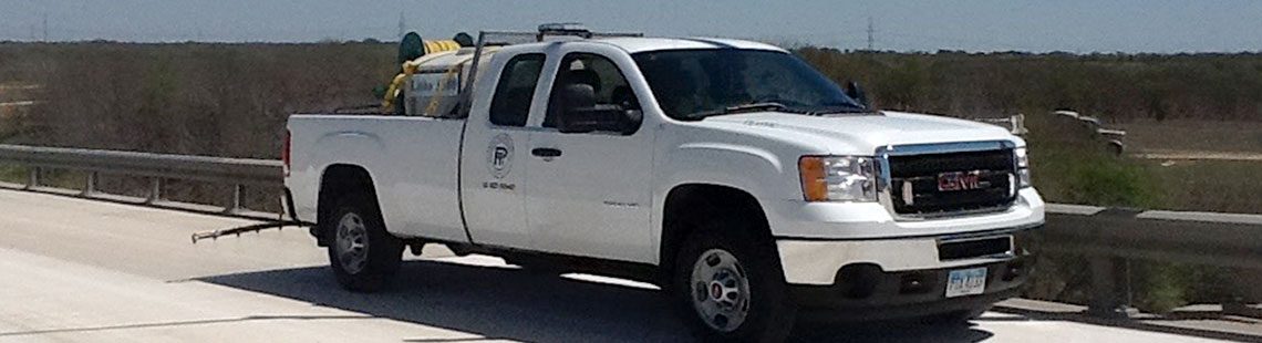 Pavement Technology Inc truck applying Litho1000Ti to a concrete bridge deck